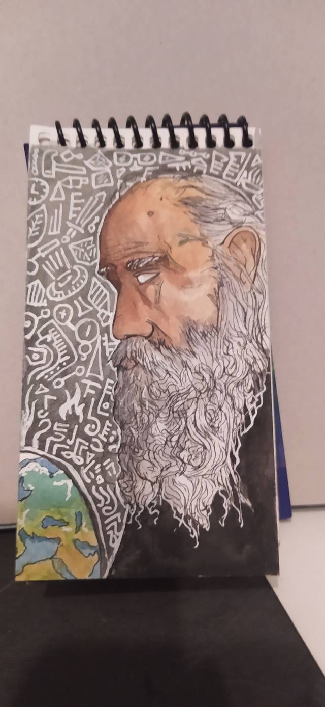 Ink and watercolor profile of a bald man with a long white beard against a black background filled with white doodles, on a small spiral pad.