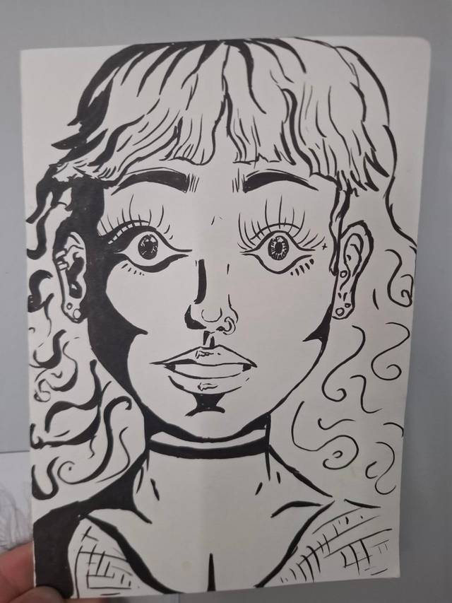 Bold black ink portrait of a young woman with curly hair, wide eyes, a choker and a patterned collar.